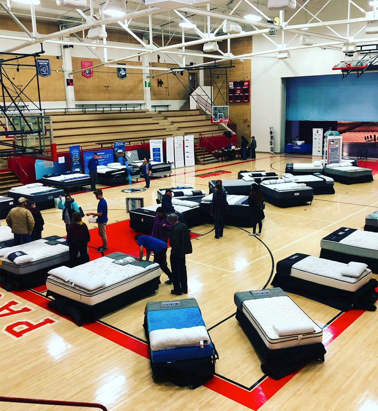 A bunch of mattresses at the gym